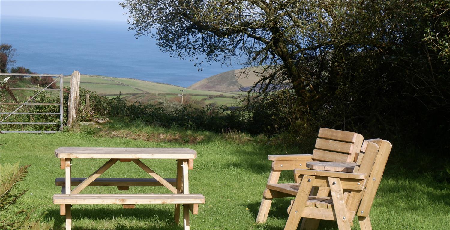 Sea view from Polrunny Farm holiday cottages breakfast garden Cornwall