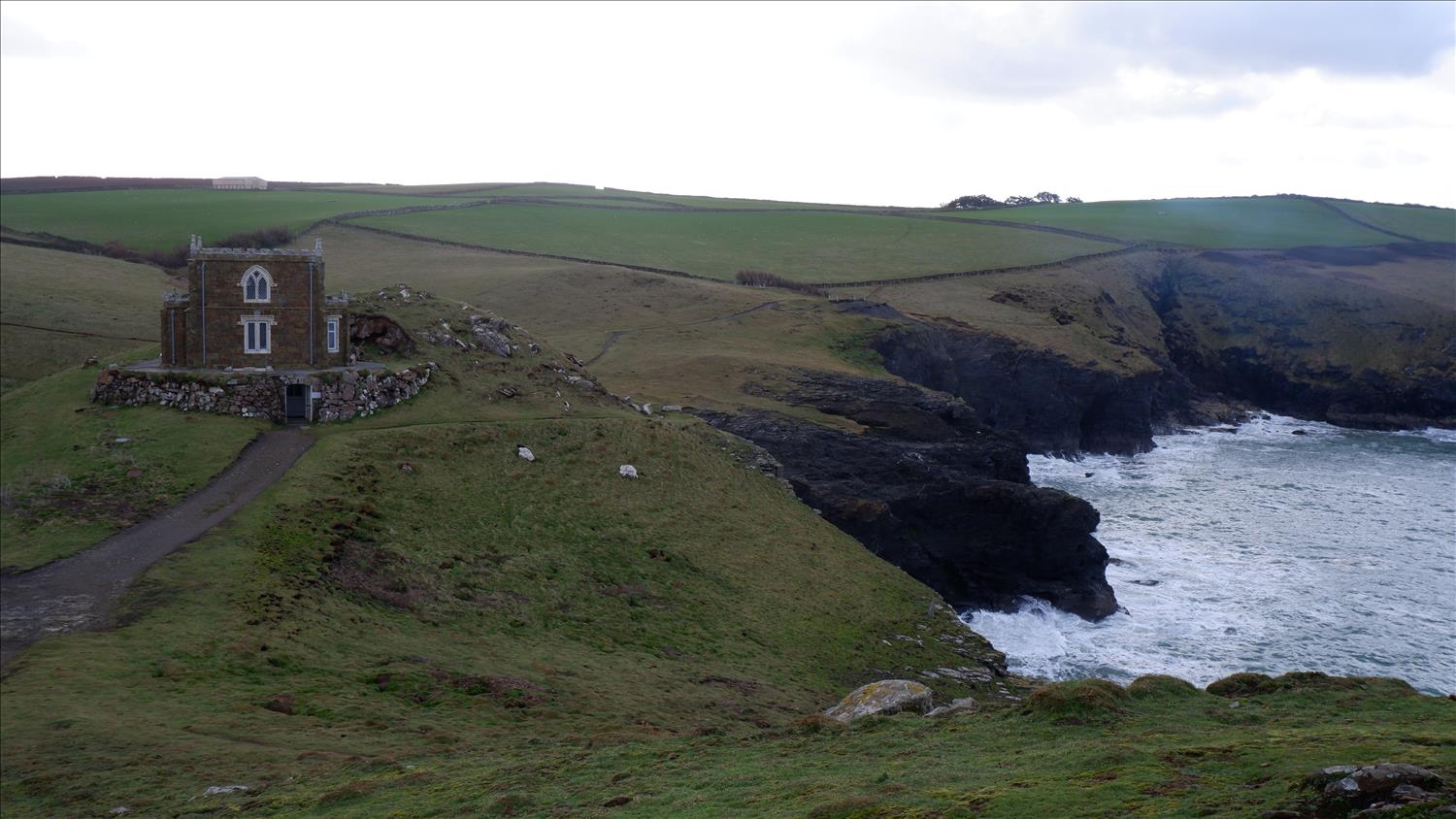 A lone cottage, named Doyden Castle, sits just off the SW Coast path, overlooking the Atlantic Ocean at  Port Quin 
