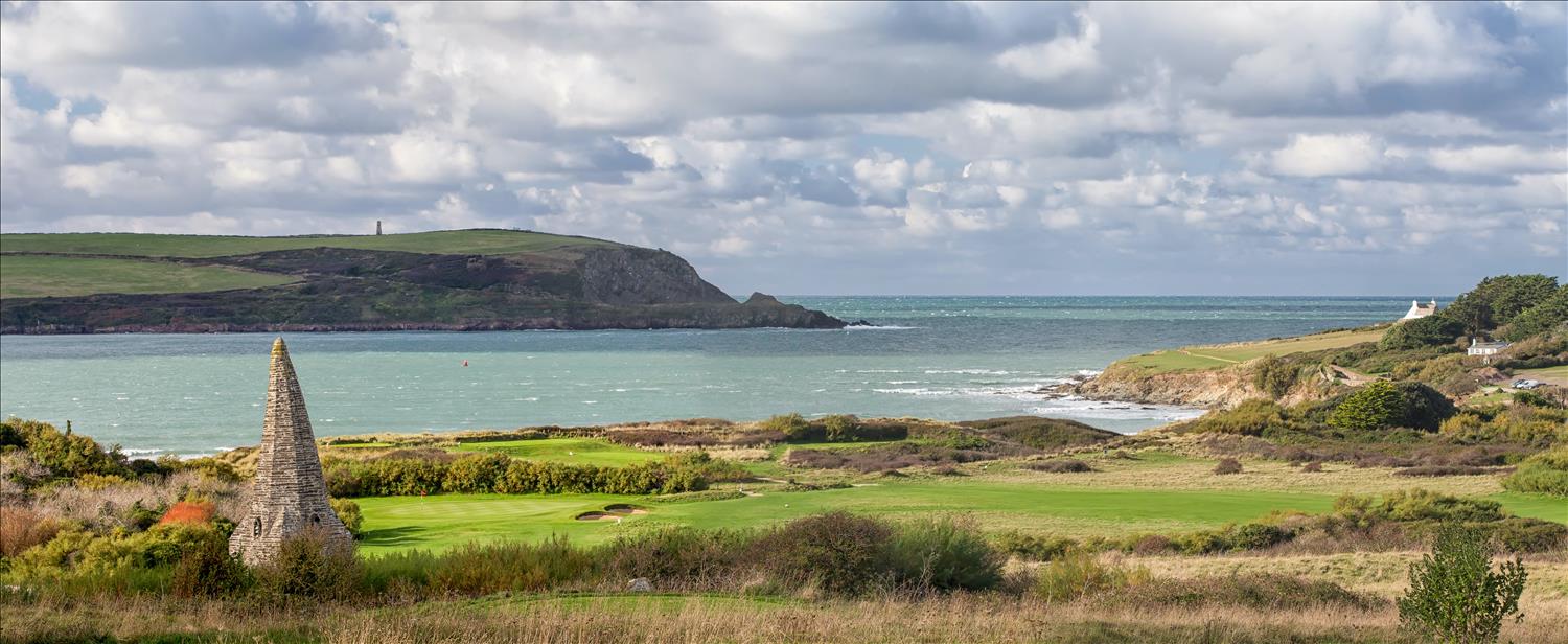 St Enodoc Golf Club, Cornwall, with the Camel Estuary in the background and St Enodoc Church's crooked spire in the foreground