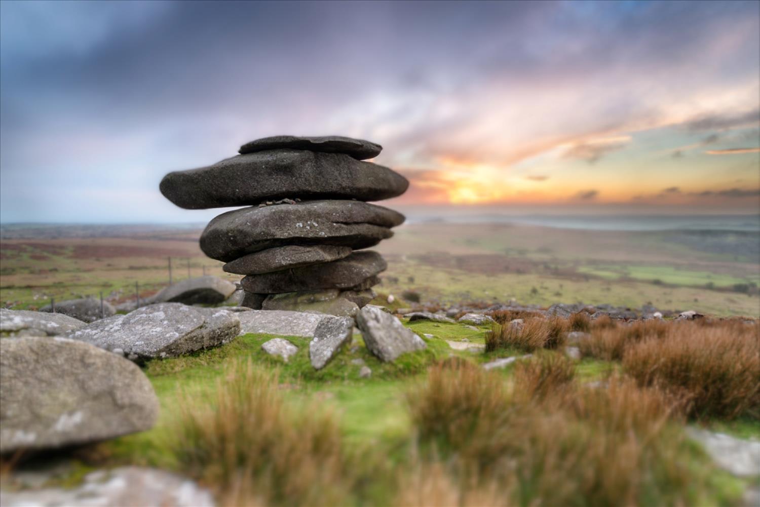 The Cheesewring, a stack of granite boulders standing proud amongst the heather on Bodmin Moor, a short car drive from our Cornish cottages at Polrunny Farm