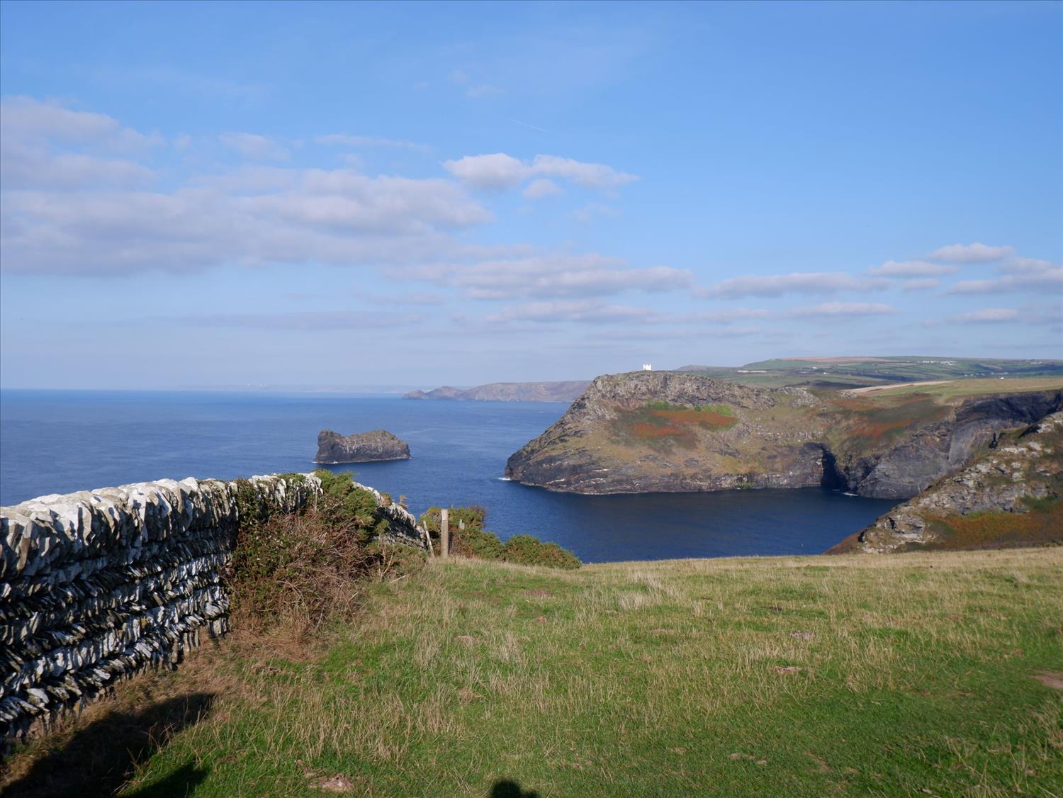 The South West Coast Path near Boscastle with The Lookout on the headland in the distance. Polrunny Farm Holiday Cottages best walking holiday in Cornwall