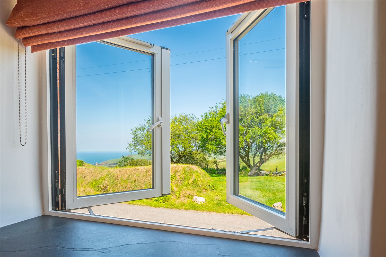 The sea view from Polrunny Farm's Seaberry Cottage - 
