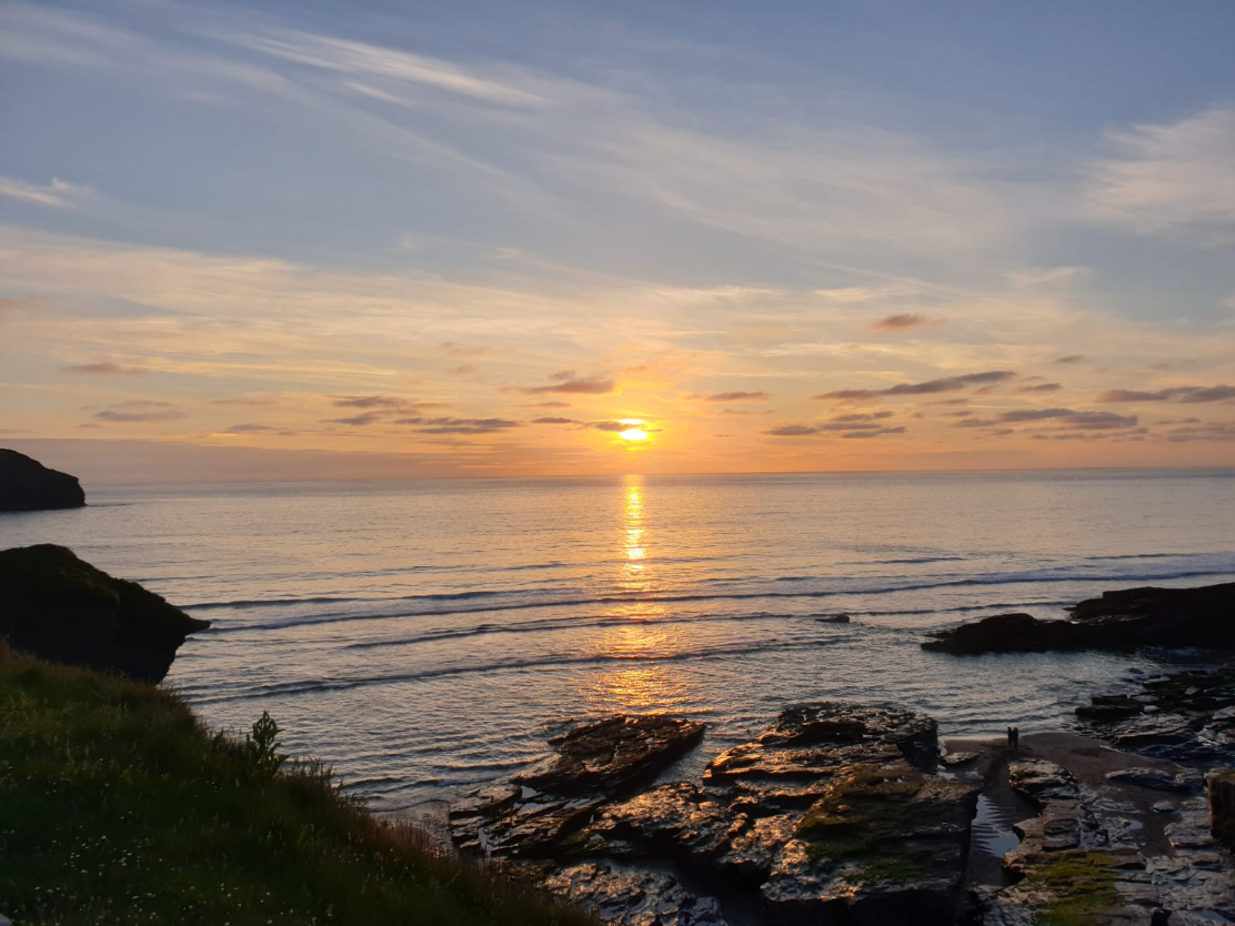 The sun sets on the North Cornish coast explain why Polrunny Farm guests have the best beach holidays in Cornwall.